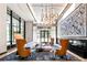 Upscale lobby with high ceilings, modern art, and comfortable seating at 2425 Peachtree Ne Rd # 1503, Atlanta, GA 30305