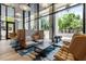 Bright lounge area with modern seating, ample natural light, and outdoor views at 2425 Peachtree Ne Rd # 1503, Atlanta, GA 30305
