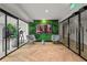 Resident lounge with modern seating, herringbone floors, and televisions at 2425 Peachtree Ne Rd # 1503, Atlanta, GA 30305