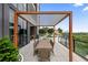 Elegant outdoor dining area with pergola, seating for eight and expansive views of the cityscape at 2425 Peachtree Ne Rd # 1503, Atlanta, GA 30305