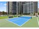Rooftop pickleball court with green turf and city views at 2425 Peachtree Ne Rd # 1503, Atlanta, GA 30305