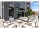 Modern rooftop patio offers comfortable seating, stylish planters, and panoramic city views at 2425 Peachtree Ne Rd # 1503, Atlanta, GA 30305