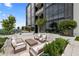 Sophisticated rooftop patio featuring comfortable seating, lush landscaping, and city views at 2425 Peachtree Ne Rd # 1503, Atlanta, GA 30305