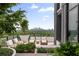 Serene rooftop terrace with city views, featuring modern outdoor furniture and lush greenery at 2425 Peachtree Ne Rd # 1503, Atlanta, GA 30305