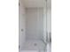 Modern bathroom has a glass door shower with gray tile at 2425 Peachtree Ne Rd # 1503, Atlanta, GA 30305