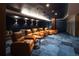 Home theater room with cozy recliners and a dark ambiance for immersive viewing at 2425 Peachtree Ne Rd # 1503, Atlanta, GA 30305