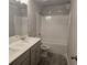 Bathroom with a double sink vanity and a shower over tub combo at 2812 Lillian Ln, Douglasville, GA 30135