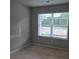 Bedroom with natural light streaming through the blinds at 2812 Lillian Ln, Douglasville, GA 30135