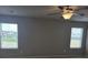 Bedroom with two windows and a ceiling fan at 2812 Lillian Ln, Douglasville, GA 30135