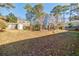 Large backyard with mature trees and privacy fence at 3312 Northcrest Rd # A, Atlanta, GA 30340