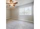 Bedroom showcasing a ceiling fan and natural light from the large window at 3312 Northcrest Rd # A, Atlanta, GA 30340