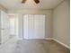 Bedroom featuring carpeted floor and closet with sliding doors at 3312 Northcrest Rd # A, Atlanta, GA 30340