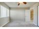 Bedroom with a ceiling fan, carpet, and a window for bright natural light at 3312 Northcrest Rd # A, Atlanta, GA 30340