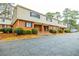 Traditional brick townhome exterior with charming entrance and well maintained landscaping at 3312 Northcrest Rd # A, Atlanta, GA 30340
