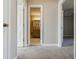 View of the hallway looking into a bathroom and bedroom that shows the home's layout at 3312 Northcrest Rd # A, Atlanta, GA 30340