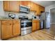 Beautiful kitchen featuring wood cabinets, granite countertops, and stainless steel appliances at 3312 Northcrest Rd # A, Atlanta, GA 30340