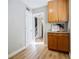 View from kitchen featuring wood cabinets and a doorway leading to another room at 3312 Northcrest Rd # A, Atlanta, GA 30340