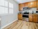 Efficient kitchen with wood cabinets, granite countertops, stainless steel appliances, and lots of natural light at 3312 Northcrest Rd # A, Atlanta, GA 30340