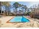 Inviting pool surrounded by mature trees and plenty of lounge chairs, perfect for relaxation at 3312 Northcrest Rd # A, Atlanta, GA 30340
