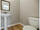 Clean powder room with pedestal sink and modern toilet at 3312 Northcrest Rd # A, Atlanta, GA 30340