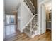 Bright foyer with a staircase featuring white railings and neutral tones at 3312 Northcrest Rd # A, Atlanta, GA 30340