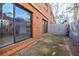 Private back patio features sliding glass doors, brick accents, with ample space for outdoor seating and relaxation at 3318 Northcrest Rd # D, Atlanta, GA 30340