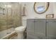 Modern bathroom featuring walk-in shower, updated vanity, and a decorative mirror at 3318 Northcrest Rd # D, Atlanta, GA 30340