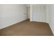 Neutral bedroom featuring carpet floors and white trim with closet at 3318 Northcrest Rd # D, Atlanta, GA 30340