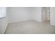 A bright bedroom with a window and view to the hallway at 3318 Northcrest Rd # D, Atlanta, GA 30340