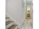 Hallway with a closet, stairs, and bathroom with grey vanity and sink at 3318 Northcrest Rd # D, Atlanta, GA 30340