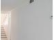 Clean interior space featuring fresh paint and an open stairway at 3318 Northcrest Rd # D, Atlanta, GA 30340