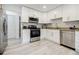 Bright kitchen features white cabinets, stainless steel appliances, and granite countertops at 3318 Northcrest Rd # D, Atlanta, GA 30340
