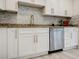 Bright kitchen features white cabinets, stainless steel appliances, and granite countertops at 3318 Northcrest Rd # D, Atlanta, GA 30340