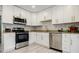 Bright kitchen features white cabinets, stainless steel appliances, and granite countertops at 3318 Northcrest Rd # D, Atlanta, GA 30340