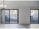 Bright living room with sliding glass doors and natural light at 3318 Northcrest Rd # D, Atlanta, GA 30340