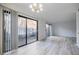 Bright living room featuring hardwood floors, sliding doors, and a neutral color palette at 3318 Northcrest Rd # D, Atlanta, GA 30340