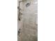 Shower features a modern shower head, neutral tile, and shower organizer at 3318 Northcrest Rd # D, Atlanta, GA 30340