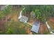 Wide aerial view of a sprawling property featuring a modern home, outbuilding, and winding driveway at 337 Paynes Lake Rd, Carrollton, GA 30116