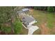 Aerial view of home with a large yard, outbuilding, and a modern driveway at 337 Paynes Lake Rd, Carrollton, GA 30116