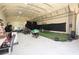 Spacious barn interior with lighting, netting, and an array of sports and fitness equipment and ample storage at 337 Paynes Lake Rd, Carrollton, GA 30116