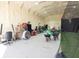 Spacious barn interior with lighting, netting, and an array of sports and fitness equipment and ample storage at 337 Paynes Lake Rd, Carrollton, GA 30116