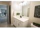 Bright bathroom features a vanity with a white countertop, and decoratives that add a nice touch at 337 Paynes Lake Rd, Carrollton, GA 30116