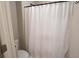 Practical bathroom with white shower curtain and neutral tones at 337 Paynes Lake Rd, Carrollton, GA 30116