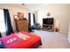 Spacious bedroom featuring dark curtains and decor, plus Cardinals themed-bedding at 337 Paynes Lake Rd, Carrollton, GA 30116