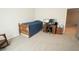 Minimalist bedroom with a wooden bed frame and a work desk setup, ideal for productivity at 337 Paynes Lake Rd, Carrollton, GA 30116