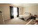 Comfortable bedroom features natural light, dark curtains, and a stylish vanity area at 337 Paynes Lake Rd, Carrollton, GA 30116