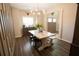 Charming dining area with hardwood floors, modern wainscotting, and a farmhouse table set at 337 Paynes Lake Rd, Carrollton, GA 30116