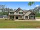Charming two-story home with a beautifully landscaped yard and a welcoming front porch at 337 Paynes Lake Rd, Carrollton, GA 30116