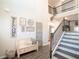 Two story foyer with stairway, bench, and welcoming decor at 337 Paynes Lake Rd, Carrollton, GA 30116