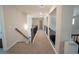 Hallway features carpeted floors, wrought iron railings and is well lit with a staircase to the side at 337 Paynes Lake Rd, Carrollton, GA 30116